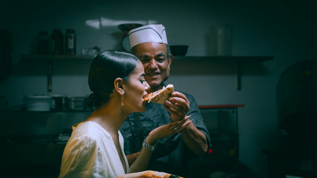 Elderly Czech couple cooking together in a traditional home kitchen