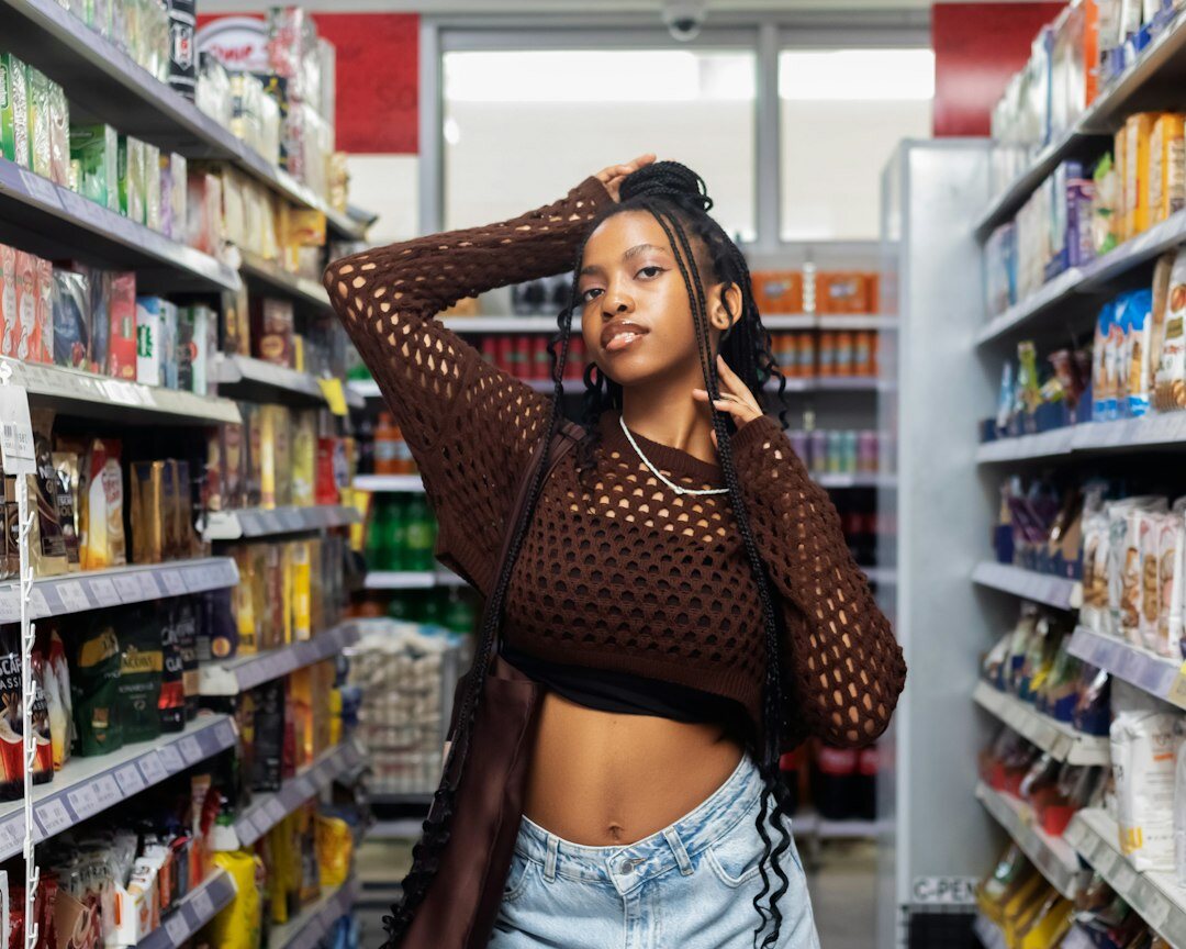woman checking grocery list in supermarket